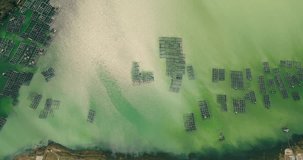 Aerial footage of amazing turquoise  Lake Batur near Batur volcano, contaminated with sulfur, Bali, Indonesia 