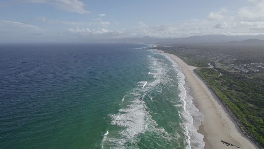 Beaumaris Beach With Turquoise Waters And Vegetation In Break O