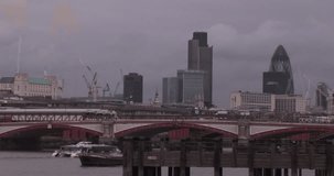 Animation of biometric photo and data processing over london cityscape. Global business, finances, computing and data processing concept digitally generated video.
