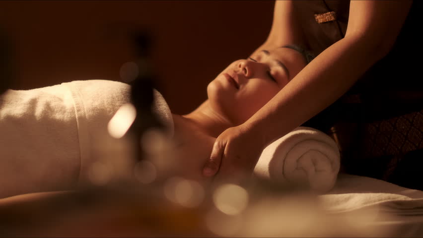 Relaxation Asian woman customer get service aromatherapy massage neck and shoulder with masseuse in spa salon. Royalty-Free Stock Footage #1102539097