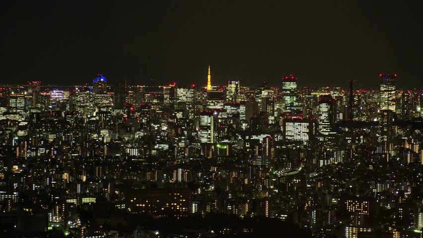 TOKYO, JAPAN : Aerial high angle sunrise CITYSCAPE of TOKYO. View of office buildings around Shinjuku and Minato ward. Long time lapse shot, night to morning. Japanese urban metropolis concept video.