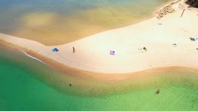 Drone aerial view, the stunning beauty of a sandbar emerges. Its contours and textures are revealed in stunning detail against the backdrop of clear. (Koh Phangan, Thailand). nature background video
