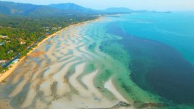 The beach is relatively quiet and peaceful, making it an ideal spot for those looking to escape the crowds and enjoy a more relaxed atmosphere. (Koh Samui, Thailand). aerial view. Travel Concepts
