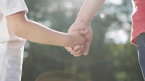 Happy family father and daughter.Holding hands together. Happy family in park at sunset. Dad is holding his daughter hands. Hands at sunset.Happy family concept.Hands of father and daughter at sunset. - Powered by Shutterstock - Get 15% off with code: PIKWIZARD15