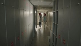 A team of doctors communicate at the end of the working day in the locker room of the hospital - Powered by Shutterstock - Get 15% off with code: PIKWIZARD15