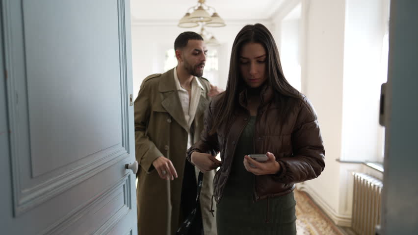 Couple leaving home. People preparing to leave residence