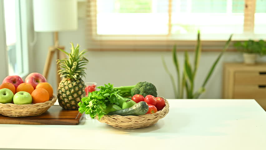 Different fruit vegetable on table with blender.