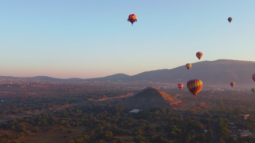 Sunrise on hot air balloon over the Teotihuacan pyramid