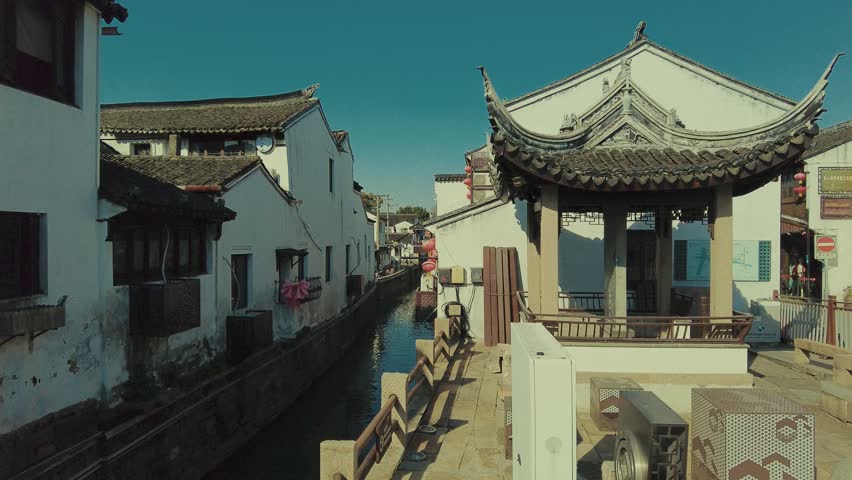 Urban street view with old buildings and stores in city of Suzhou in Jiangsu, China
