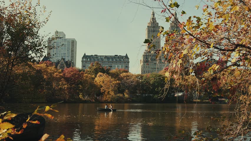 People in boat in lake in Central Park in slow motion in Autumn in New York City USA Royalty-Free Stock Footage #1102604287