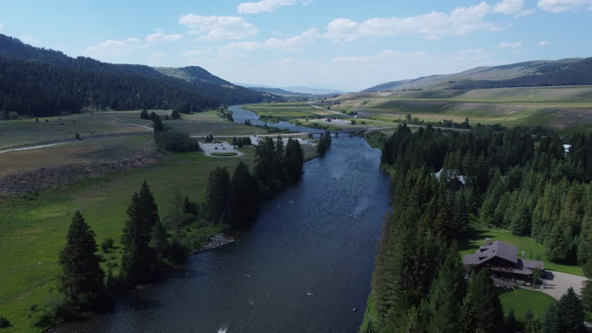 A farmhouse getaway vacation spot by the river in rural Montana in summer 2022.