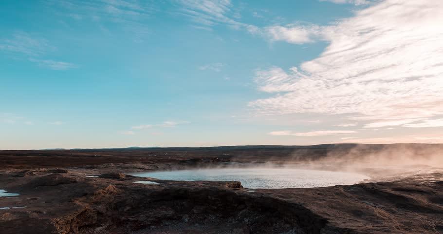 Timelapse video of Geysers and steam ponds in the Geysir National Park, Iceland. Everything surrounded by a fall landscape with warm colors