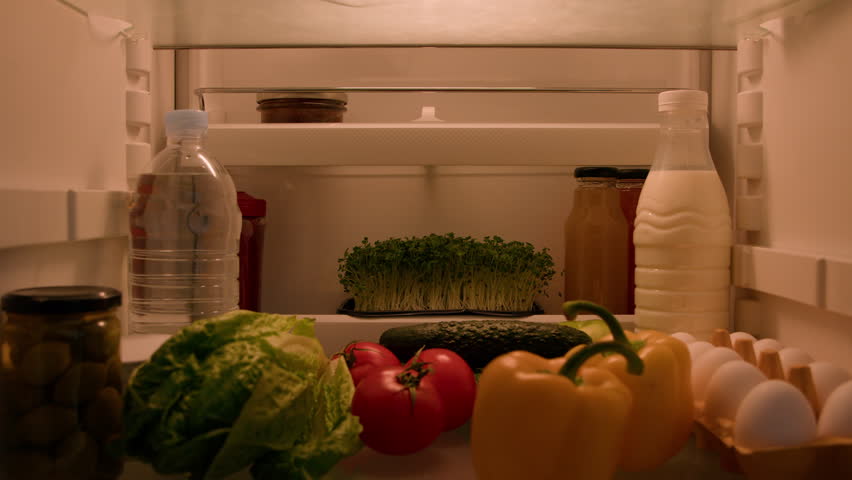 Point of view POV inside refrigerator Caucasian man male chef open fridge with vegetables products take tomato, pepper and cucumber for cooking fresh salad dinner at kitchen food delivery healthy diet Royalty-Free Stock Footage #1102614151