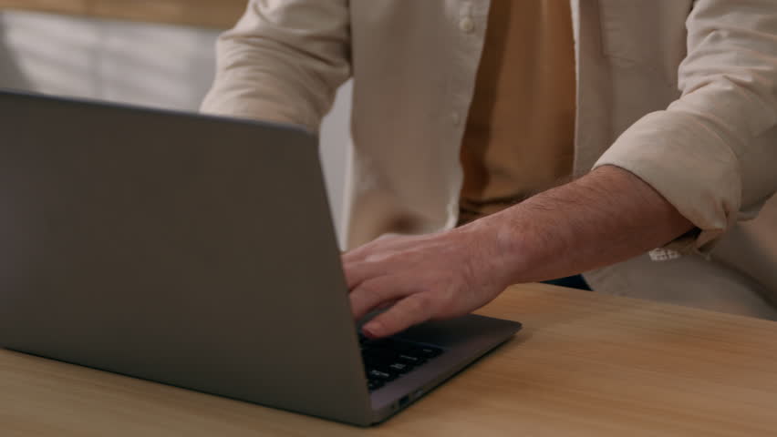 Moving shot Caucasian tired exhausted man working laptop at kitchen overworked freelancer male with computer suffer eyestrain eyes discomfort pain ache take of glasses work break bad eyesight vision Royalty-Free Stock Footage #1102614153