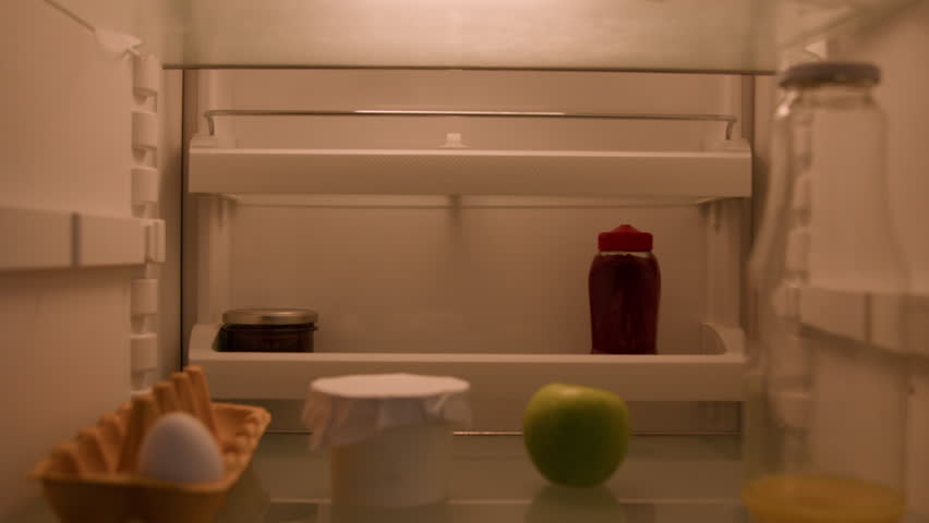 Point of view POV inside refrigerator Caucasian businessman employer busy man open fridge with one egg, apple and empty bottle of juice talking phone need products call mobile food delivery service Royalty-Free Stock Footage #1102614159