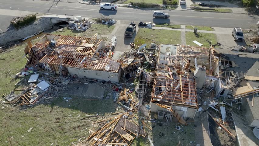 Damage in a neighborhood from March 31, 2023 tornado in Little Rock, Arkansas and drone video pulling up. Royalty-Free Stock Footage #1102615135