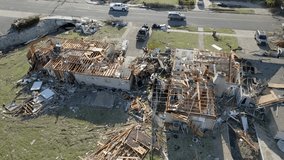 Damage in a neighborhood from March 31, 2023 tornado in Little Rock, Arkansas and drone video pulling up.