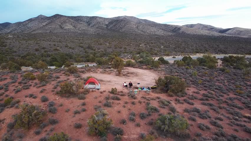 Tourists Camping At The Desert Mountains Near Las Vegas in Red Rock Canyon Nevada, USA. Aerial Shot