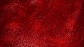 Countless vortex movement of gold particles in the red liquid. Golden glittering sparkling particles in red fluid motion. Bright magical galaxy with gold dust particles in slow motion. - Powered by Shutterstock - Get 15% off with code: PIKWIZARD15