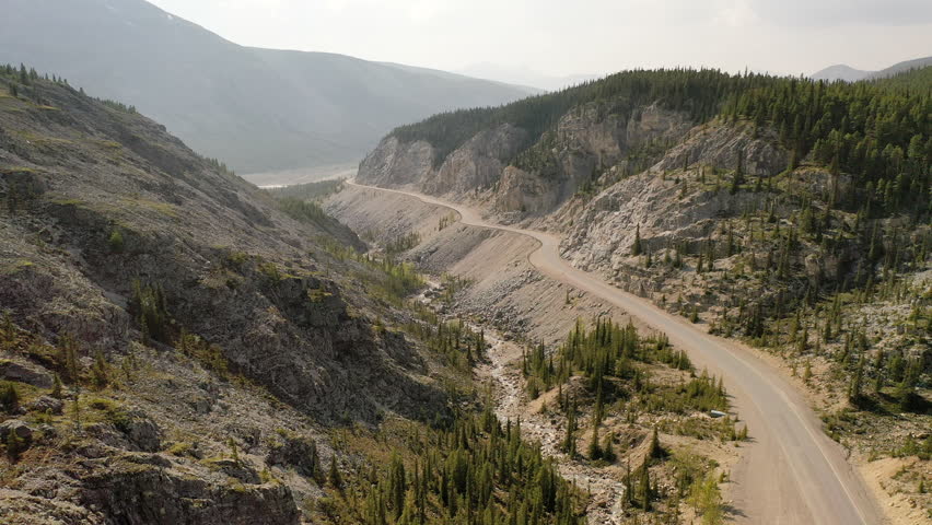  Aerial view the Alaska highway in Stone Mountain Provincial Park, Northern Rockies, British Columbia, Canada