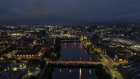 Establishing Aerial View Shot of Glasgow UK, Lanarkshire, Renfrewshire, Scotland United Kingdom, night evening blue hour, super clear, super sharp, push along the river