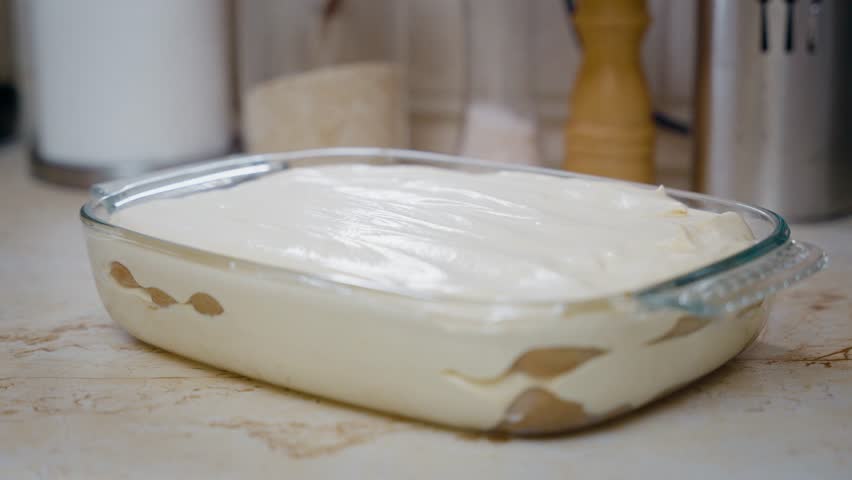 Sprinkles Cocoa Powder On TastyTiramisu Italian Dessert.