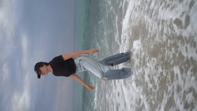 Young woman walking in the sea water alone Slow Motion