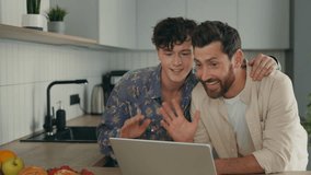 Happy LGBT Gays Feeling Cheerful, Couple Using the Laptop for Video Call to Show the Proposal Ring to Their Relatives Online Telling Them Good News. Technology and LGBT Concept - Powered by Shutterstock - Get 15% off with code: PIKWIZARD15