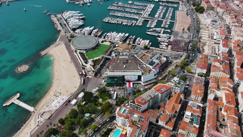 Palace of Festivals and Conferences modern building and convention centre with red carpet in France, the venue for the Cannes and Lions International Film Festivals and the NRJ Music Award aerial view Royalty-Free Stock Footage #1102642683