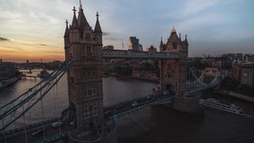 Establishing Aerial View Shot of London UK, United Kingdom, iconinc Tower Bridge, sunset, super close, feeling the bridge, slow circling right