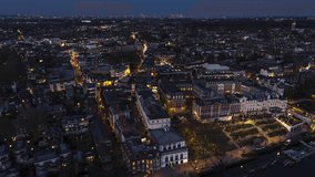 Establishing Aerial View Shot of London UK, United Kingdom, posh Richmond at night evening