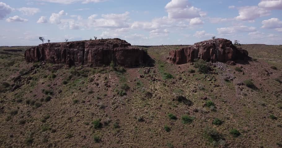 4K aerial drone video of African savanna hills, valley and rocky outcrop south of Windhoek near Hardap Dam in Namibia, southern Africa