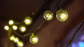 Garland of light bulbs. String light, black wire, LED lamps. Festive decoration for the holiday. Interior. Christmas, New Year, party. Decorative illumination - Powered by Shutterstock - Get 15% off with code: PIKWIZARD15