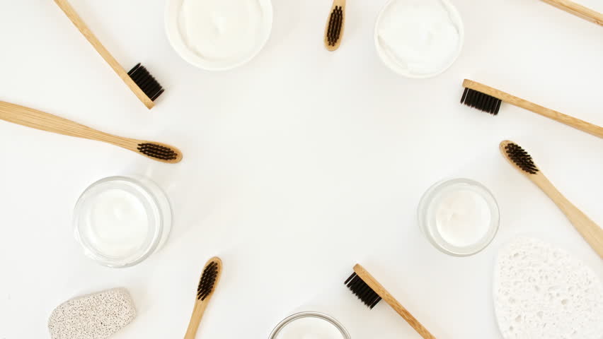 Eco-friendly biodegradable Bamboo toothbrush, White cosmetic bottle containers. Natural skin care products . Zero waste, eco friendly and spa accessories. Beauty SPA branding mockup. No plastic.