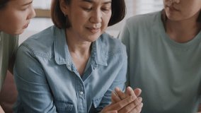 Asia people adult child help middle aged old mom crying grief loss tired hold hand stress relief talk with love care at home. Young woman listen to older mum pain sad worry lost in life crisis issues. - Powered by Shutterstock - Get 15% off with code: PIKWIZARD15