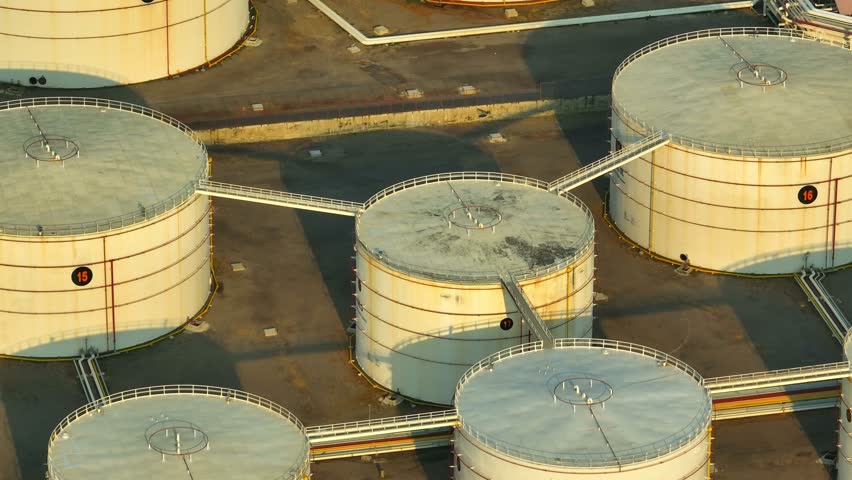 An oil depot, also known as an oil terminal or oil storage facility, is a large industrial site where crude oil or refined petroleum products are stored and distributed. Energy and fuel industry.
 Royalty-Free Stock Footage #1102668059