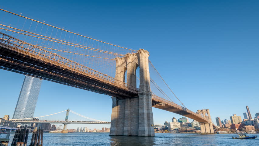 Motion Timelapse of Brooklyn Bridge and East river at sunny afternoon | Shutterstock HD Video #1102668101