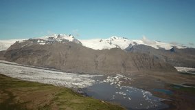 Aerial drone footage of Vatnajokull ice tongue. Skaftafell glacier with icebergs floating in a glacier lagoon. Scenic view of Vatnajokull. Artic nature ice landscape. Melting glacier in Iceland.