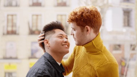 Gay couple about to kiss on the balcony స్టాక్ వీడియో