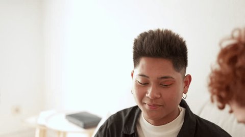 Gay man laughing while is being making upの動画素材