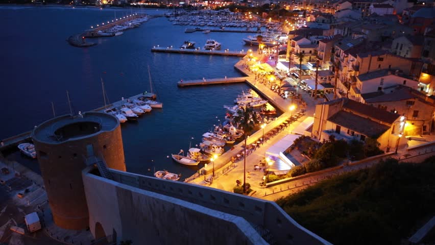 Illuminated evening cityscape of Calvi port. Fabulous summer scene of Corsica island, France, Europe. Incredible seascape of Mediterranean sea. Full HD video (High Definition).