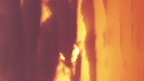 VERTICAL VIDEO: Beautiful time lapse sunrise through the clouds.  - Powered by Shutterstock - Get 15% off with code: PIKWIZARD15