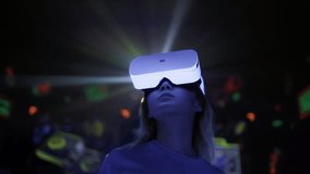 Virtual and augmented reality. Young asian woman wearing VR headset in cyber space with neon icons. Girl in 3D glasses at digital interactive show, entertainment of future. Metaverse concept - Powered by Shutterstock - Get 15% off with code: PIKWIZARD15