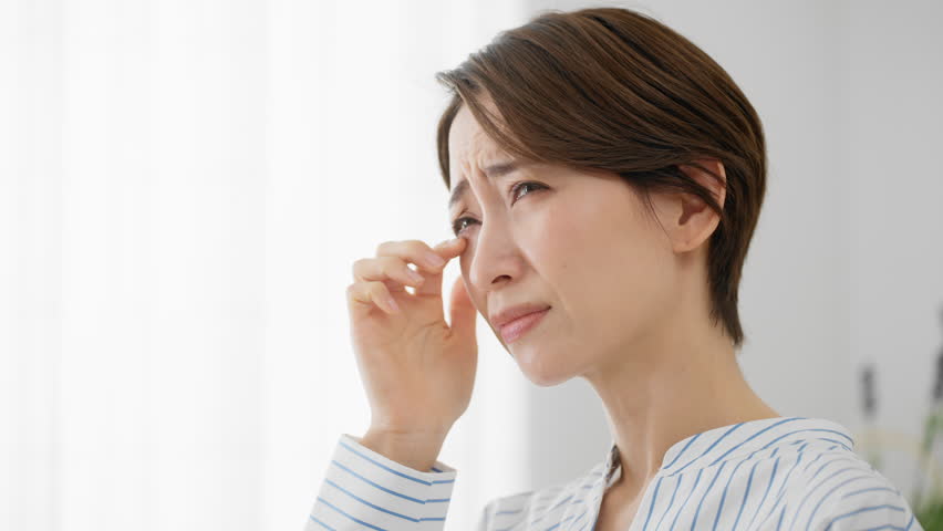 Hay fever image of a young woman scratching her eyes Royalty-Free Stock Footage #1102682233