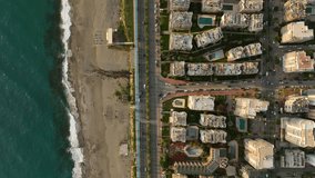 Road traffic on the coastline of the city of Alanya, Cars drive along the road aerial view Panorama Of The Buildings On The Coastline City Alanya Turkey Aerial view