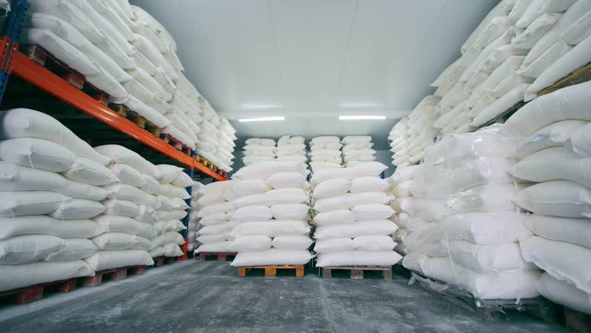 A Large Warehouse With Bags Of Flour, Sugar, Salt And Rice. Warehouse With White Bags For Long-term Storage. Royalty-Free Stock Footage #1102688129