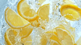 Super Slow Motion Shot of Fresh Lemon Slices Falling into Water Whirl at 1000 fps. - Powered by Shutterstock - Get 15% off with code: PIKWIZARD15