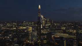 Establishing Aerial View Shot of London UK, United Kingdom, Shard and City of London, excellent tones, super clear image, circling right revealing city