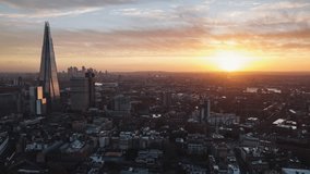 Establishing Aerial View Shot of London UK, United Kingdom, shard, extrordinary sunrise, tracking left