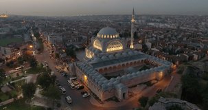 Aerial video in the evening over a mosque in Istanbul Turkey with the city in the background